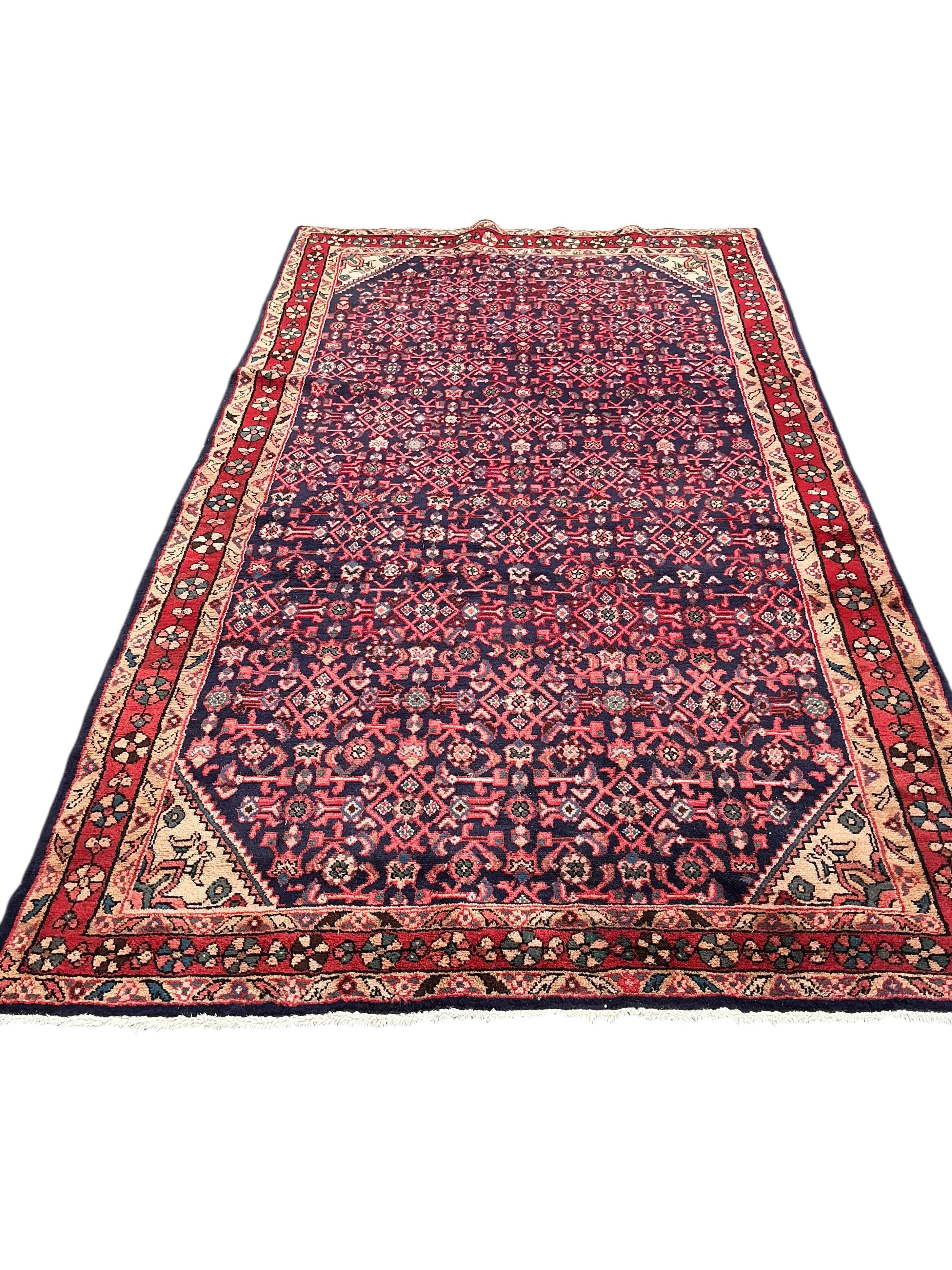 A Hamadan red ground carpet, 282 x 159cm